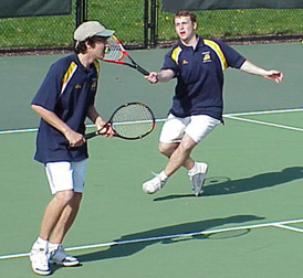 Jeremy Van Fleet '01 looks on as partner Sean Robb '01 volleys.